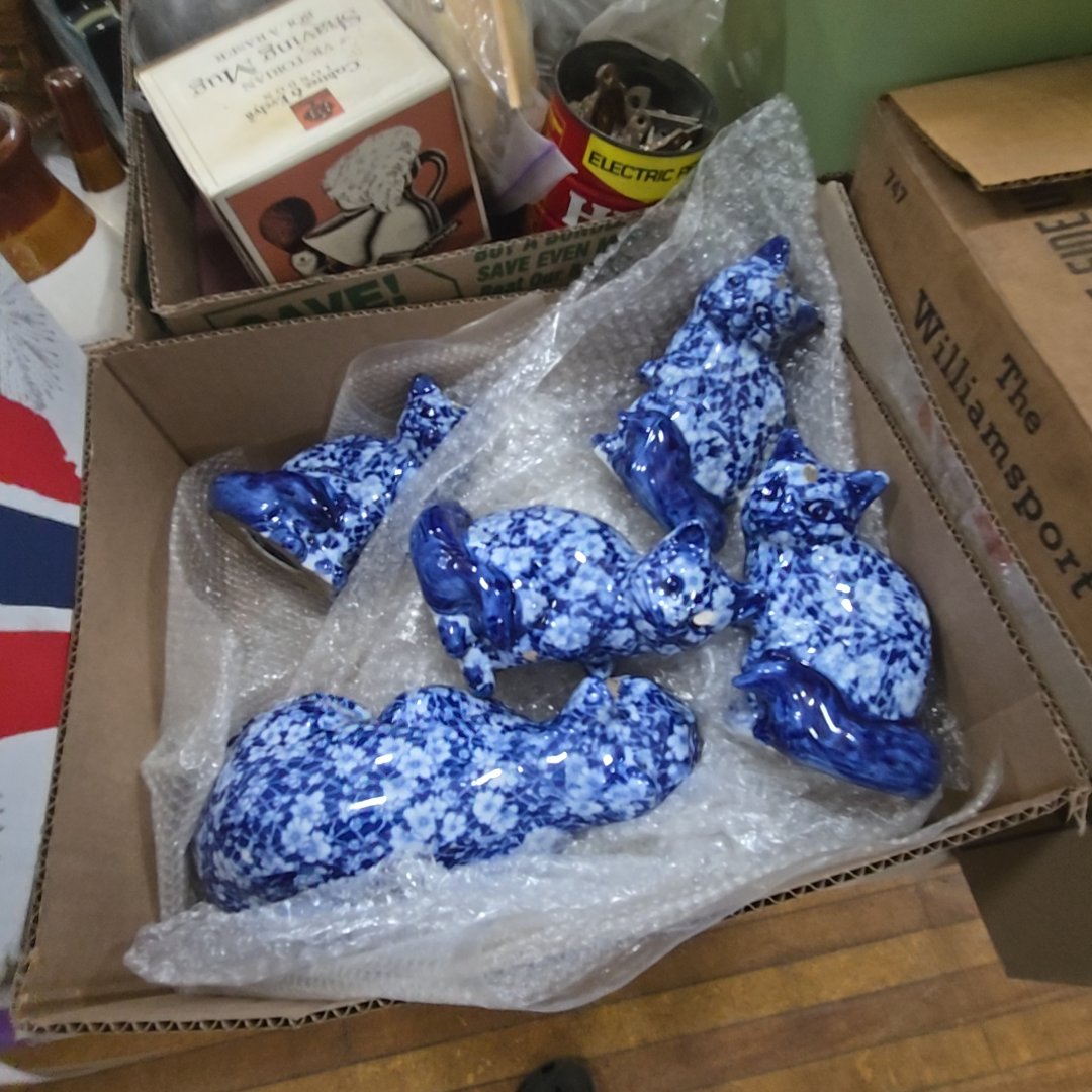box lot with blue and white ceramic cats