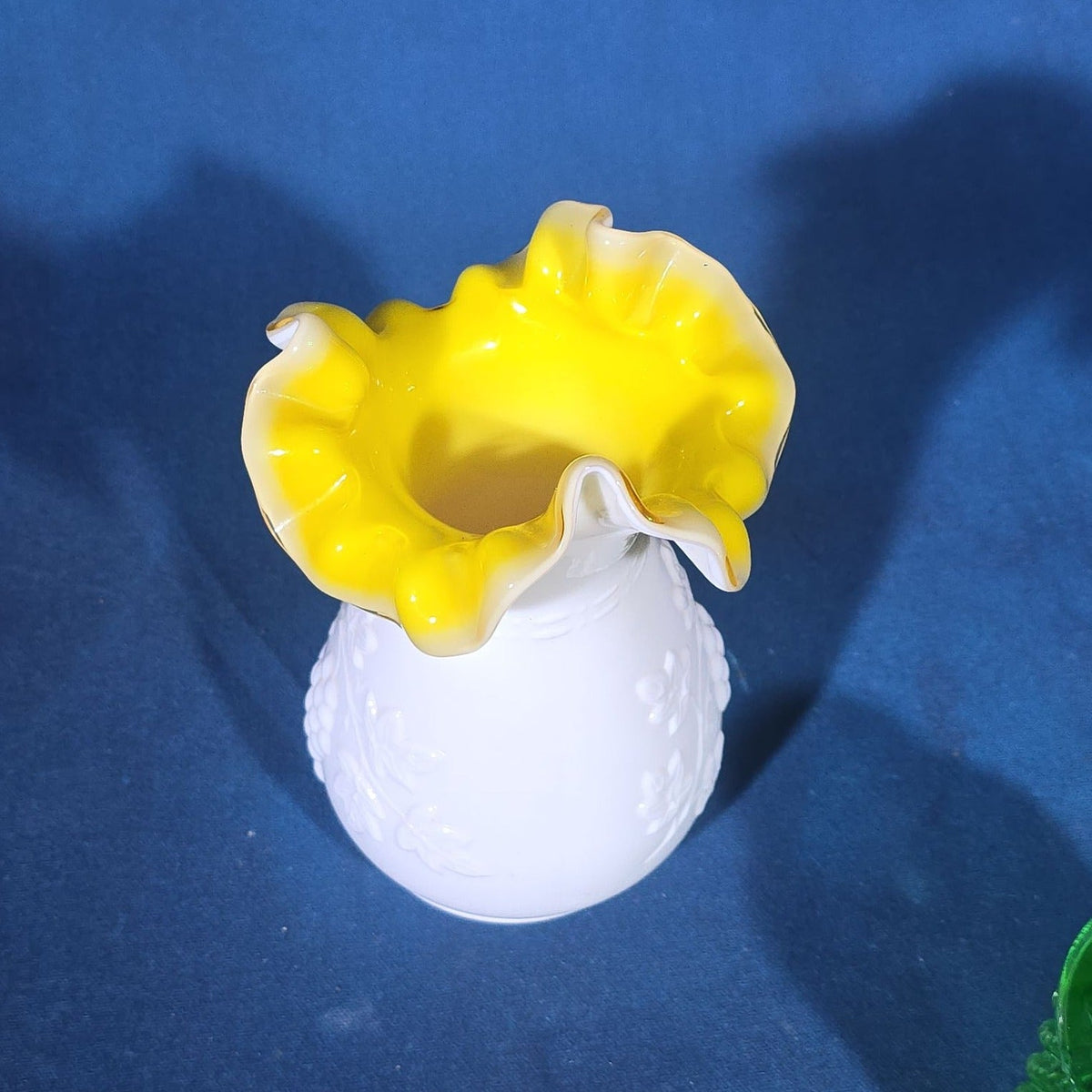 Pair of Vintage Art Glass Pieces including White Cased Glass Vase with Yellow Ruffled Rim and Green Hobnail Glass Decanter with Stopper