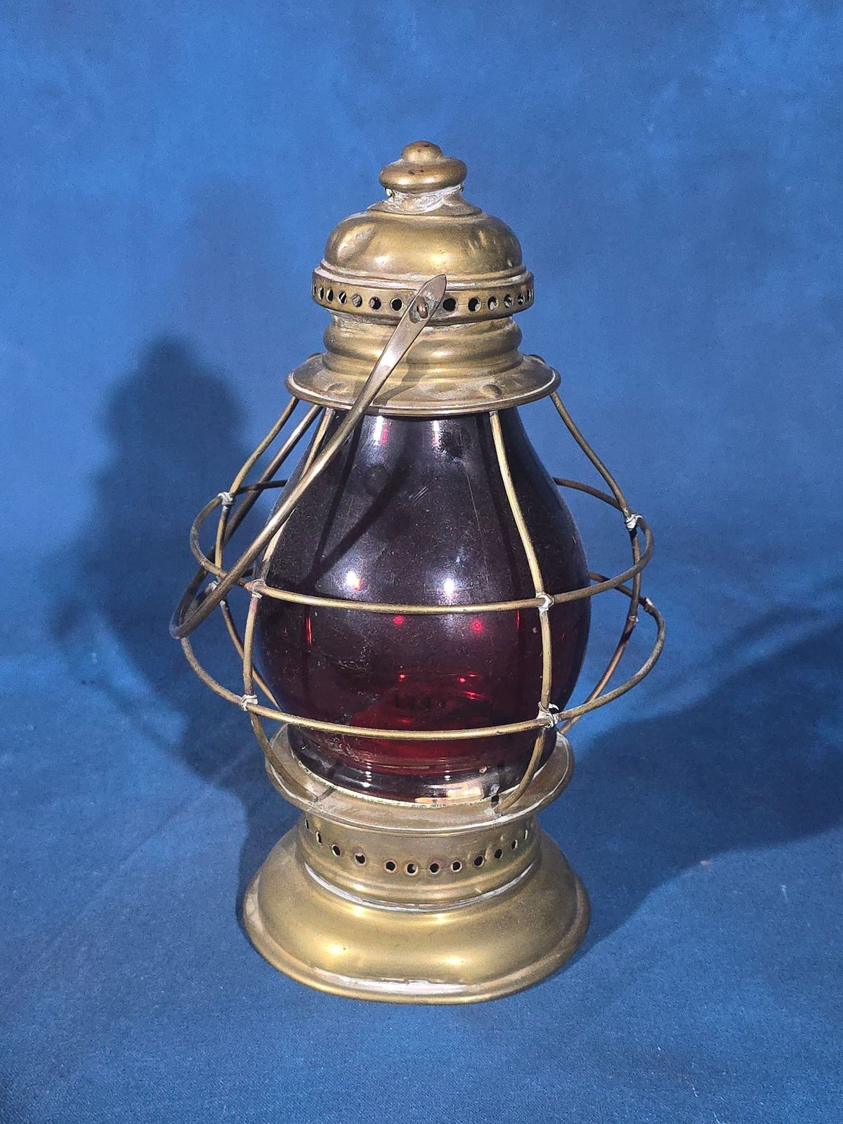 Antique Brass Lantern with Red Globe and Wire Cage Guard