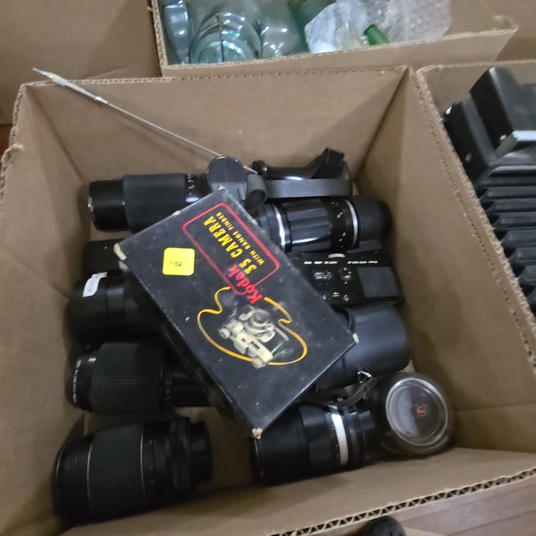 box lot of camera lenses