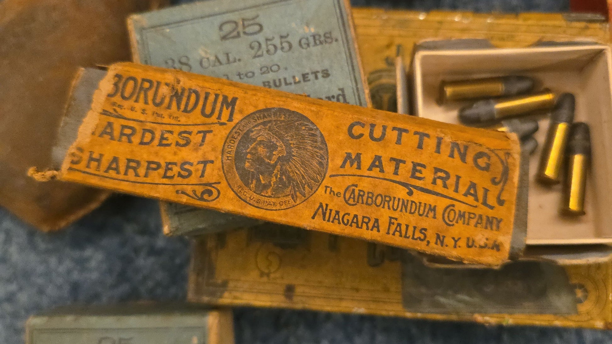 Grouping of Antique and Vintage Ammunition Boxes with Contents and Gun Accessories including Winchester .40-72 Cartridges for Model 1895, Union Metallic Cartridge Co. Ballard & Bullard Bullets, and Colt Grip Panel