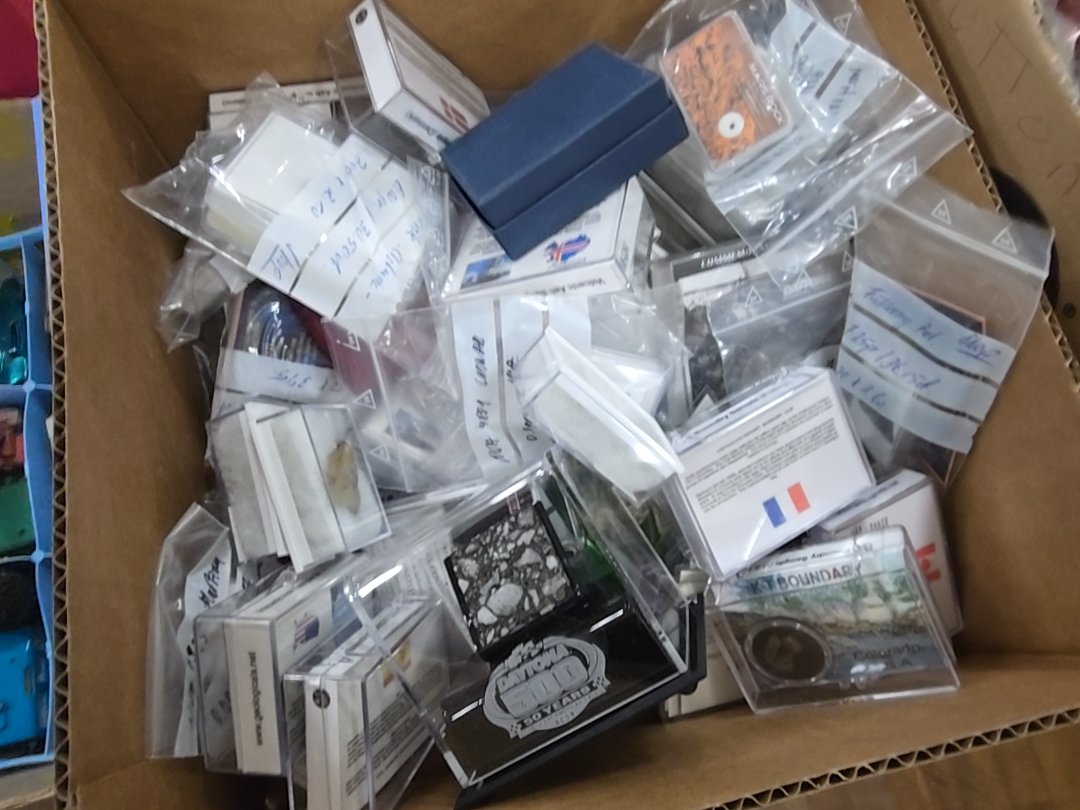 box lock of commemorative material including chunks of Mars and other swatches