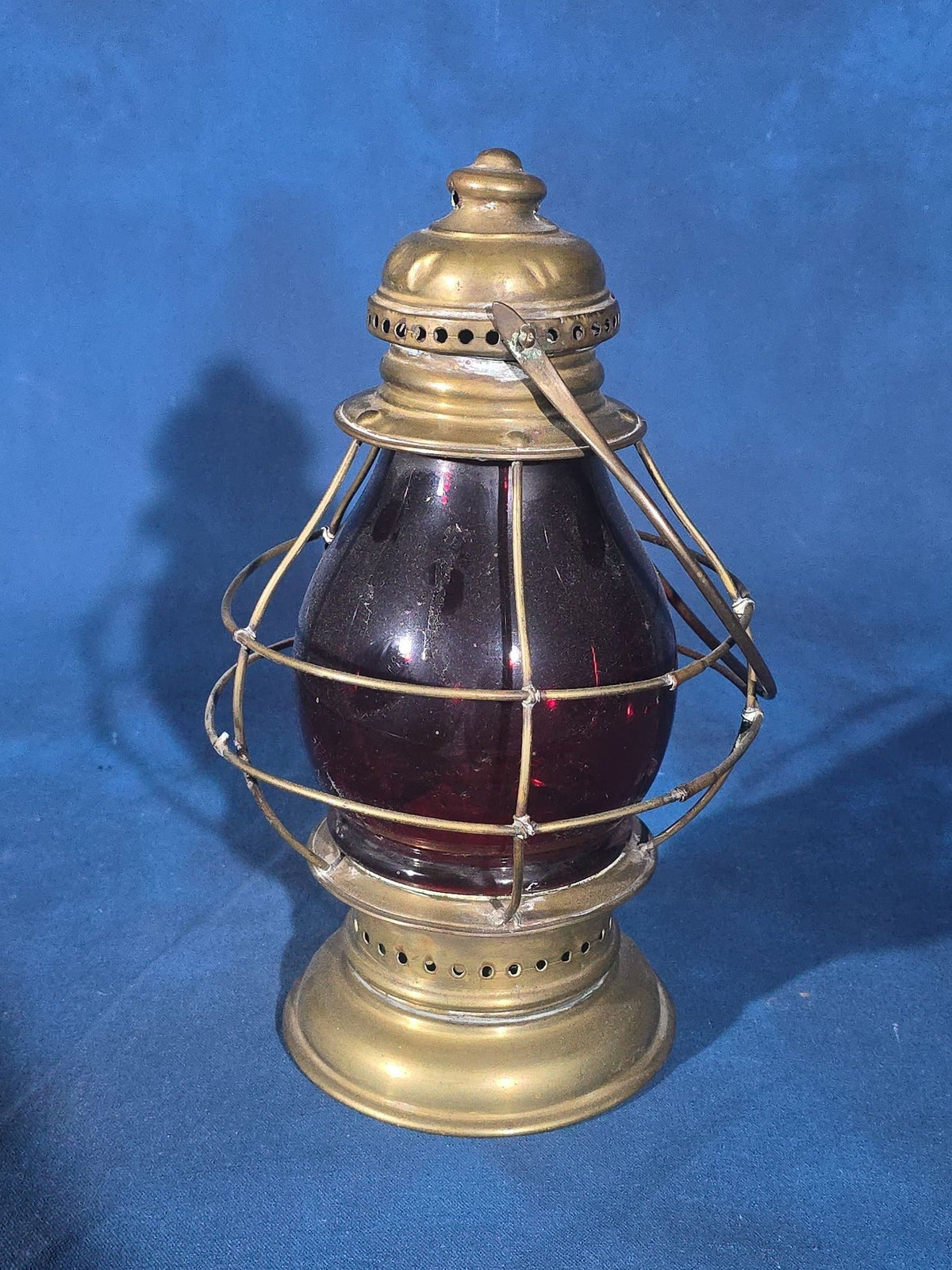 Antique Brass Lantern with Red Globe and Wire Cage Guard