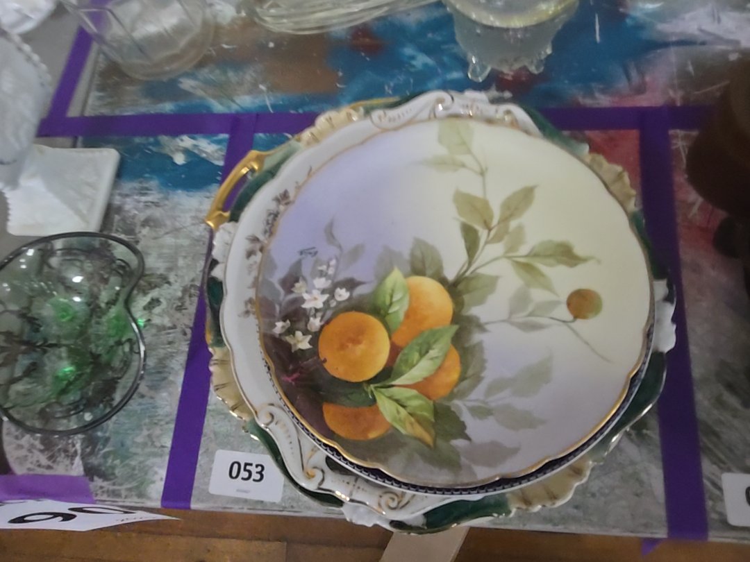 mixed grouping of various decorated China plates