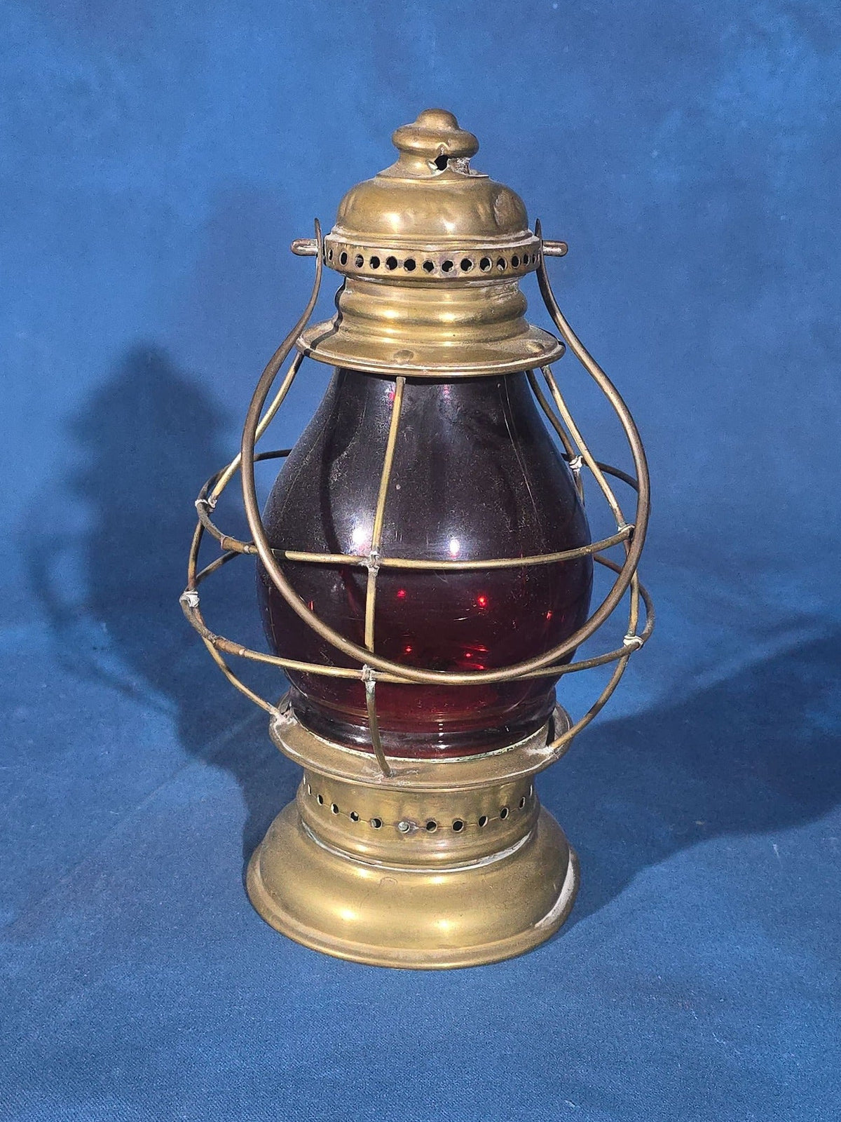 Antique Brass Lantern with Red Globe and Wire Cage Guard