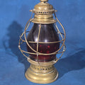 Lot 121 - Antique Brass Lantern with Red Globe and Wire Cage Guard, 12-1/2" H
