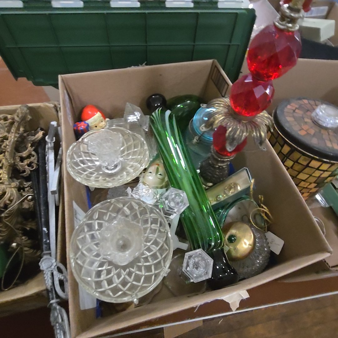 box lot with glassware including art glass rolling pin, candlesticks, and red Glass Lamp base