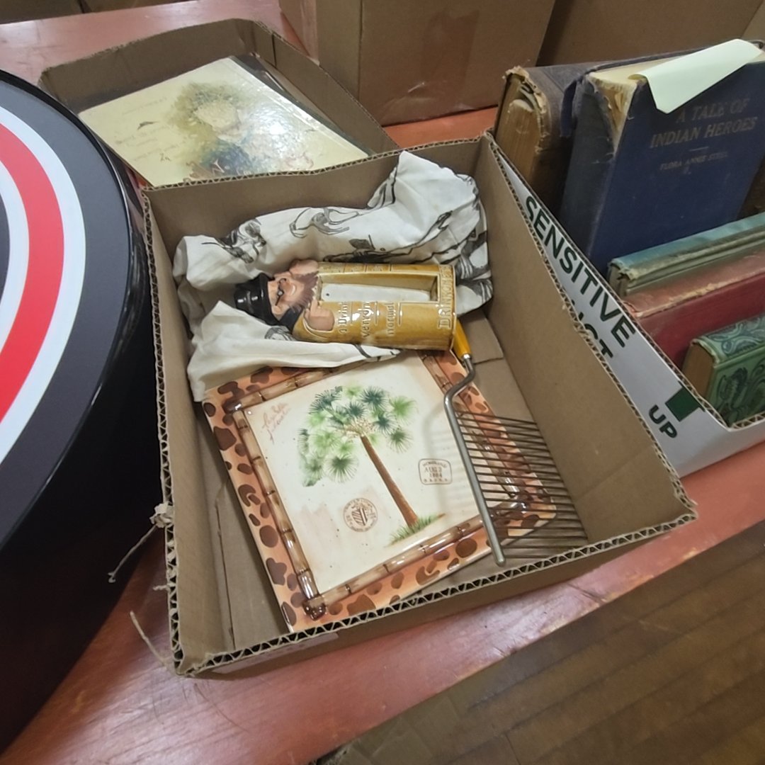 box lot with Hawaiian plate, drunk man, and first aid bandage