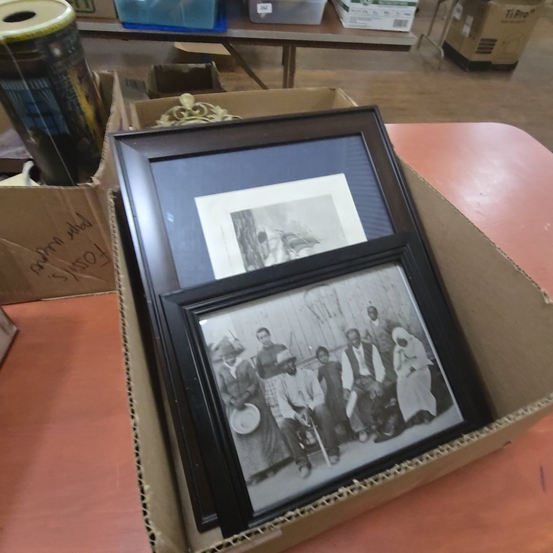pair of framed items including modern digital print of black family, and antique engraving of tall ship battle