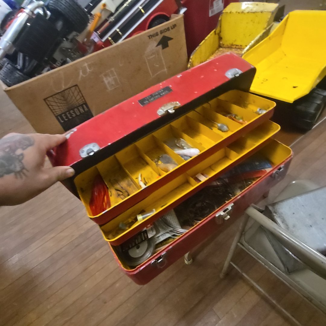 red tackle box with contents