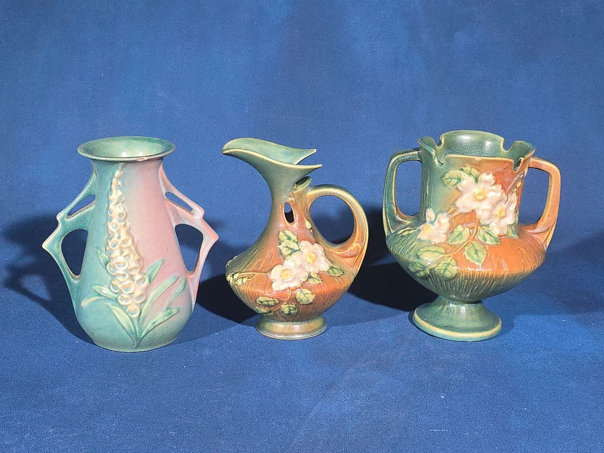 Trio of Vintage Roseville Pottery Pieces including Foxglove Vase 44-6", White Rose Ewer 981-6", and White Rose Vase 146-6", Chips to All Three
