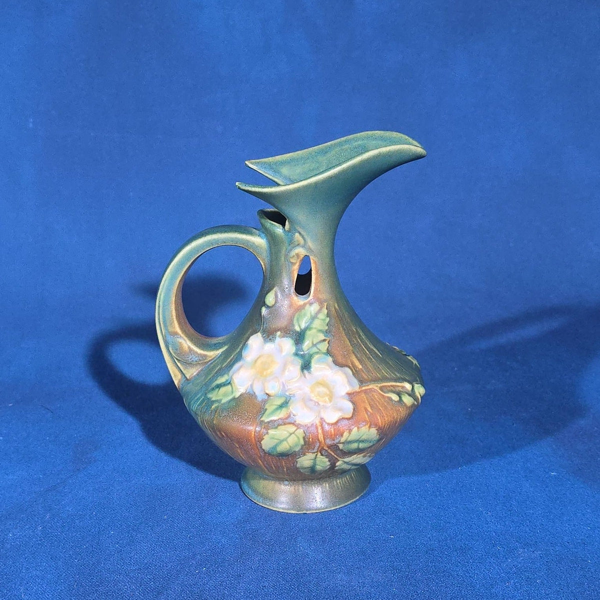 Trio of Vintage Roseville Pottery Pieces including Foxglove Vase 44-6", White Rose Ewer 981-6", and White Rose Vase 146-6", Chips to All Three