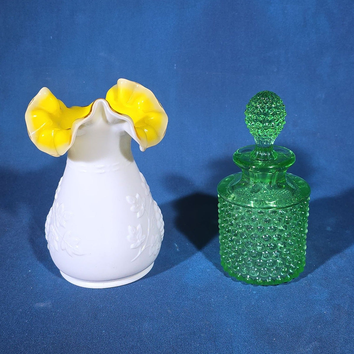 Pair of Vintage Art Glass Pieces including White Cased Glass Vase with Yellow Ruffled Rim and Green Hobnail Glass Decanter with Stopper