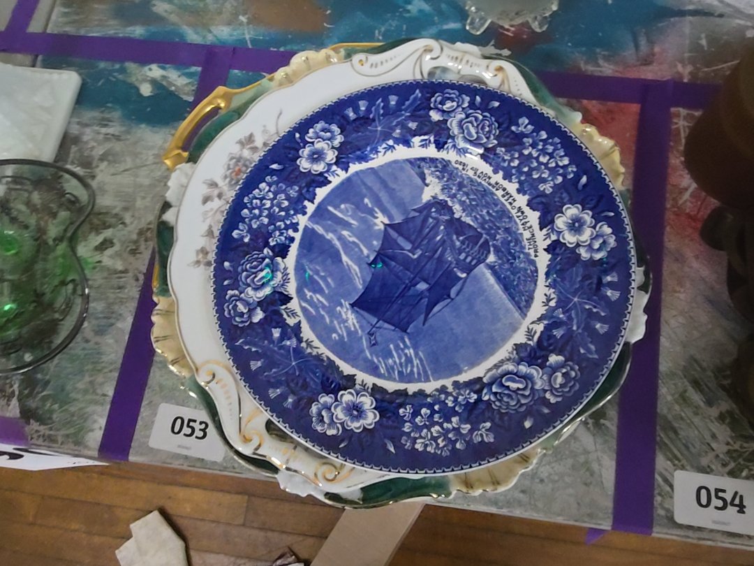 mixed grouping of various decorated China plates