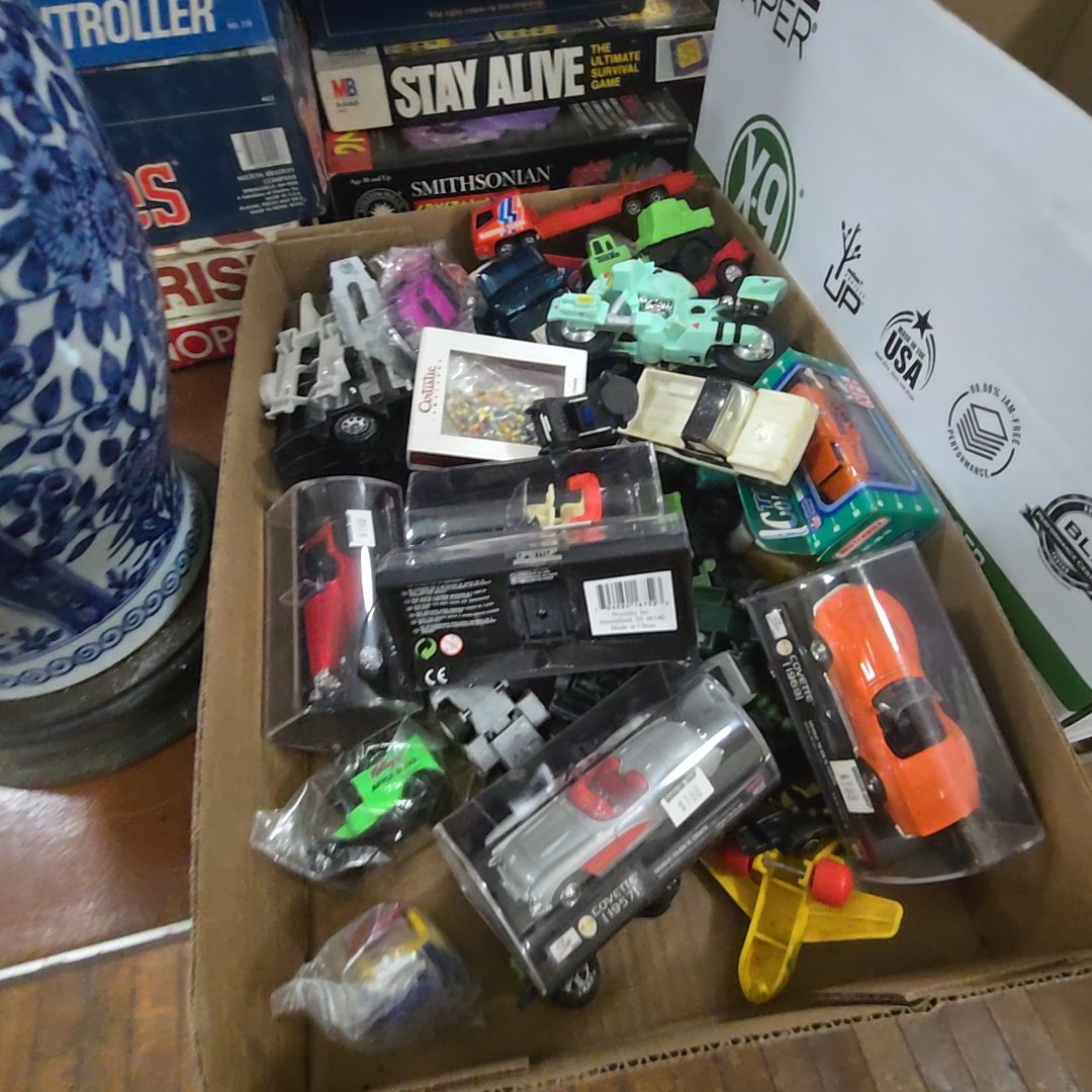 box lot with many toy cars