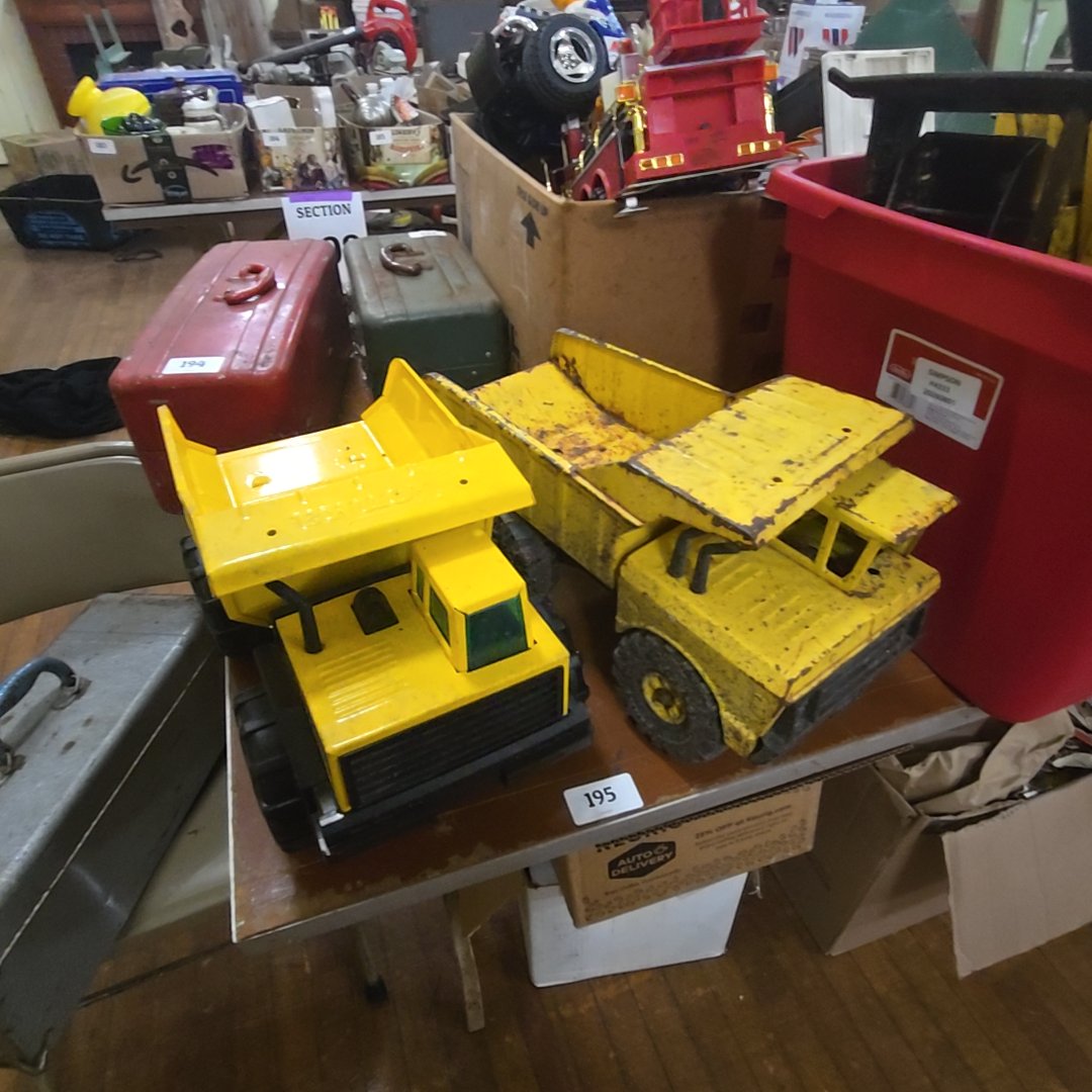 pair of Tonka dump trucks