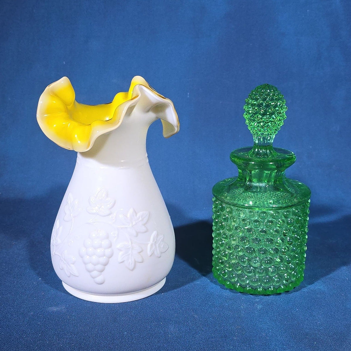 Pair of Vintage Art Glass Pieces including White Cased Glass Vase with Yellow Ruffled Rim and Green Hobnail Glass Decanter with Stopper