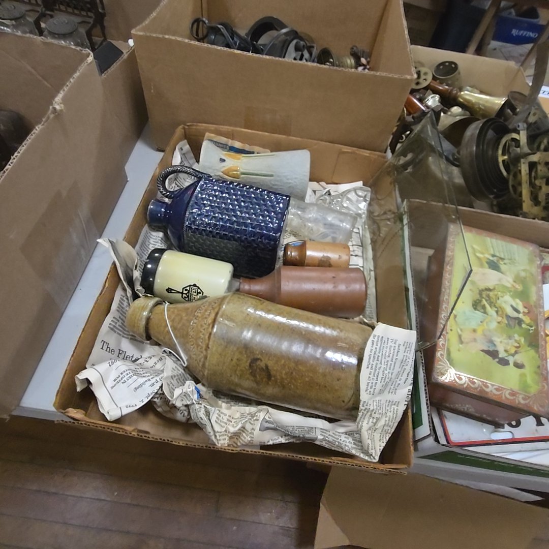 box lot with stoneware bottles, glass dog, and more