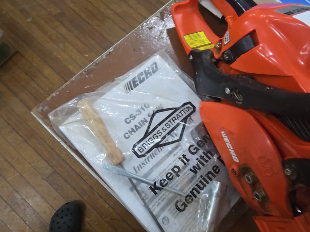 Echo cs-310 chainsaw with tools and bar and chain oil