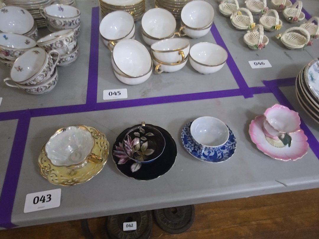grouping of four vintage tea cups and saucers
