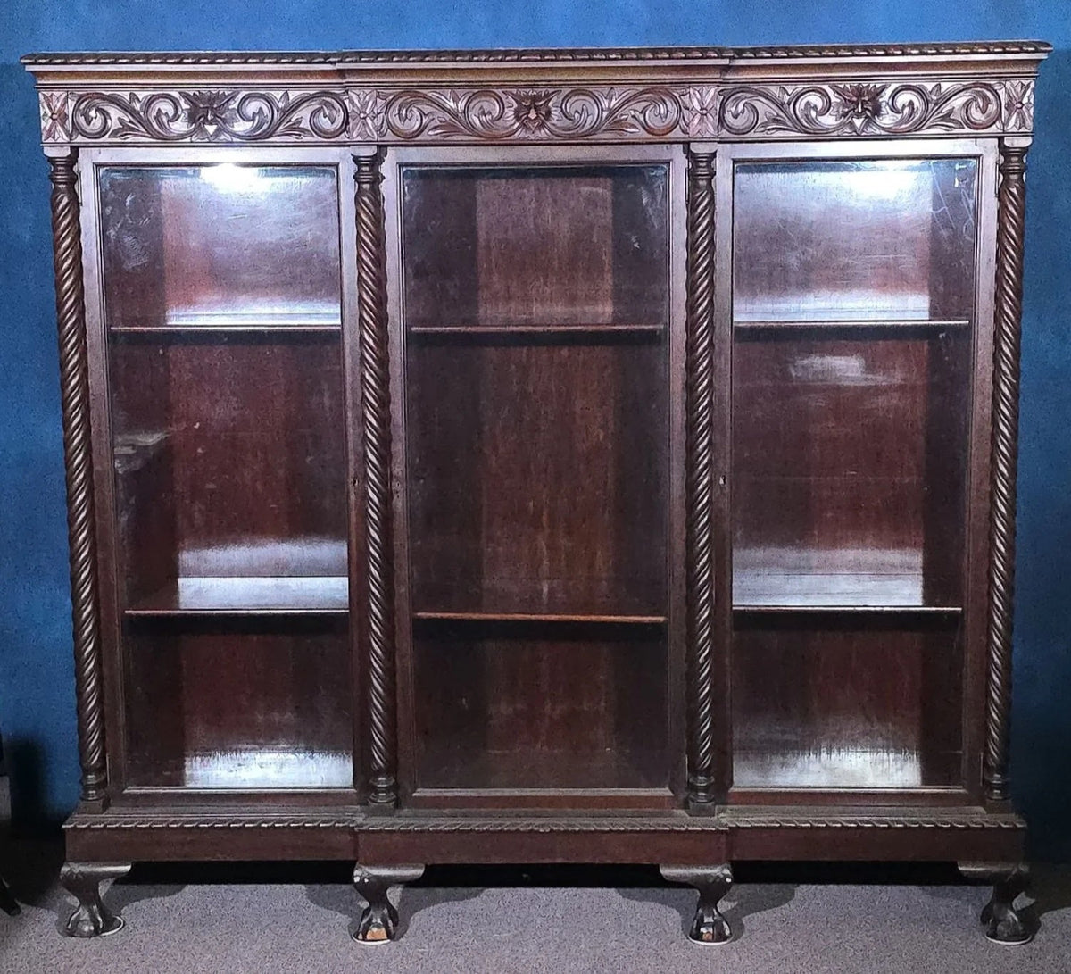Antique Carved Three-Door Glass-Front Bookcase with Green Man Masks, Rope-Twist Columns, and Claw-and-Ball Feet