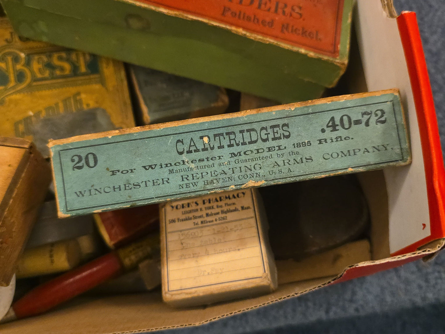 Grouping of Antique and Vintage Ammunition Boxes with Contents and Gun Accessories including Winchester .40-72 Cartridges for Model 1895, Union Metallic Cartridge Co. Ballard & Bullard Bullets, and Colt Grip Panel