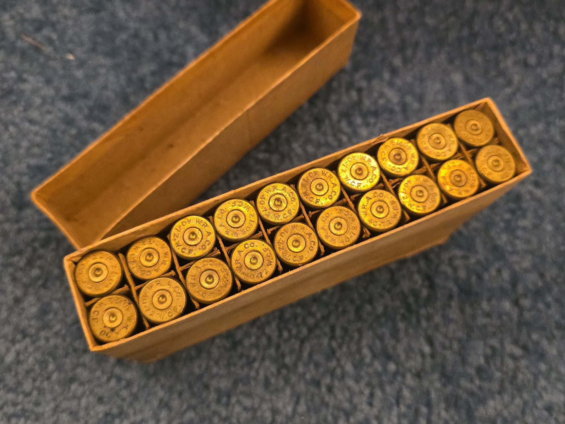 Grouping of Antique and Vintage Ammunition Boxes with Contents and Gun Accessories including Winchester .40-72 Cartridges for Model 1895, Union Metallic Cartridge Co. Ballard & Bullard Bullets, and Colt Grip Panel