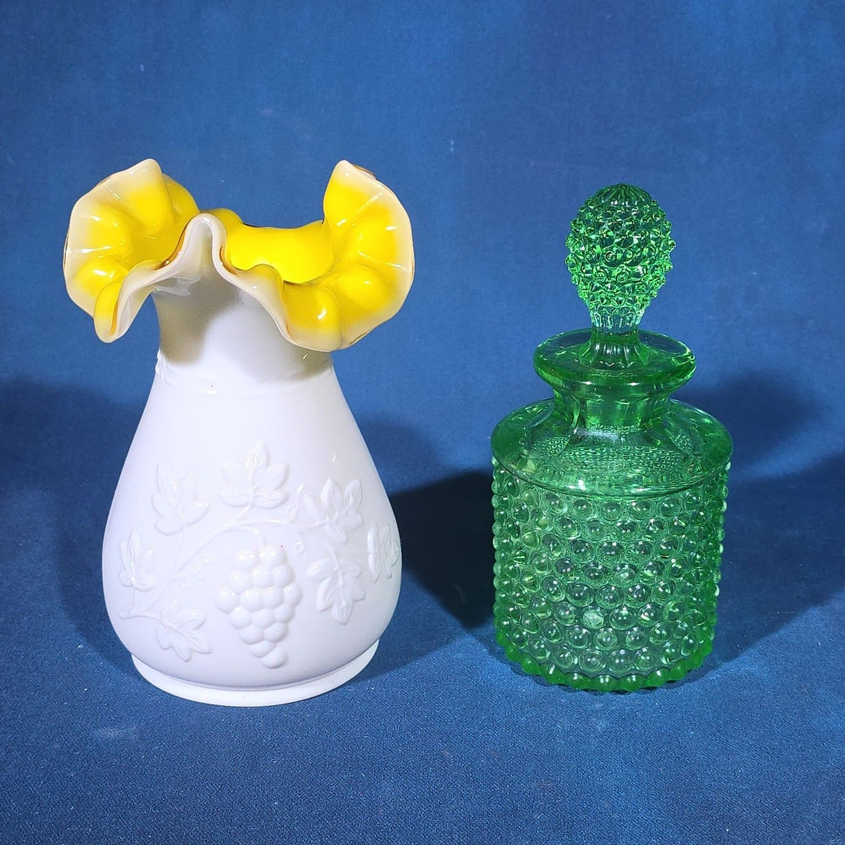 Pair of Vintage Art Glass Pieces including White Cased Glass Vase with Yellow Ruffled Rim and Green Hobnail Glass Decanter with Stopper