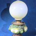 Lot 123 - Antique Converted Kerosene Parlor Lamp with Lion Head Font and Tropical Scenes, Frosted Globe and Chimney, Font Marked Miller, 24" H