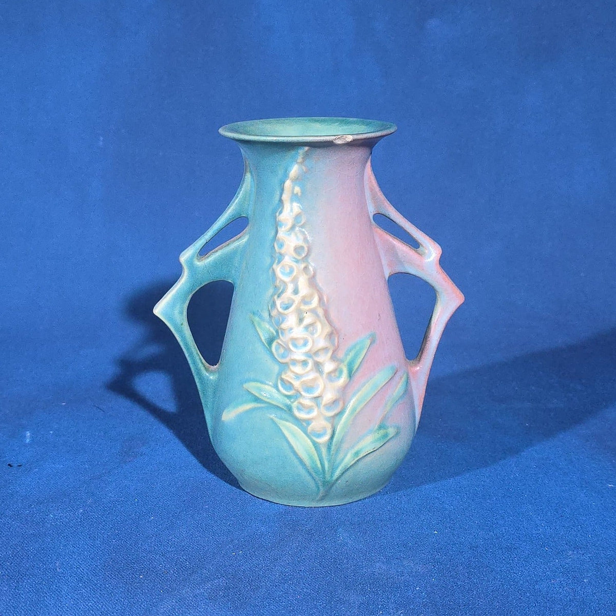 Trio of Vintage Roseville Pottery Pieces including Foxglove Vase 44-6", White Rose Ewer 981-6", and White Rose Vase 146-6", Chips to All Three