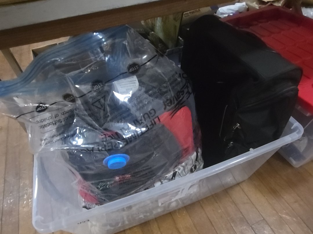 box lot of miscellaneous Linens and suitcase