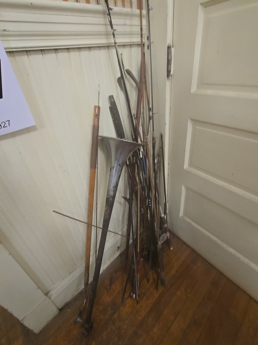 grouping of miscellaneous Fishing poles, arrows, and More
