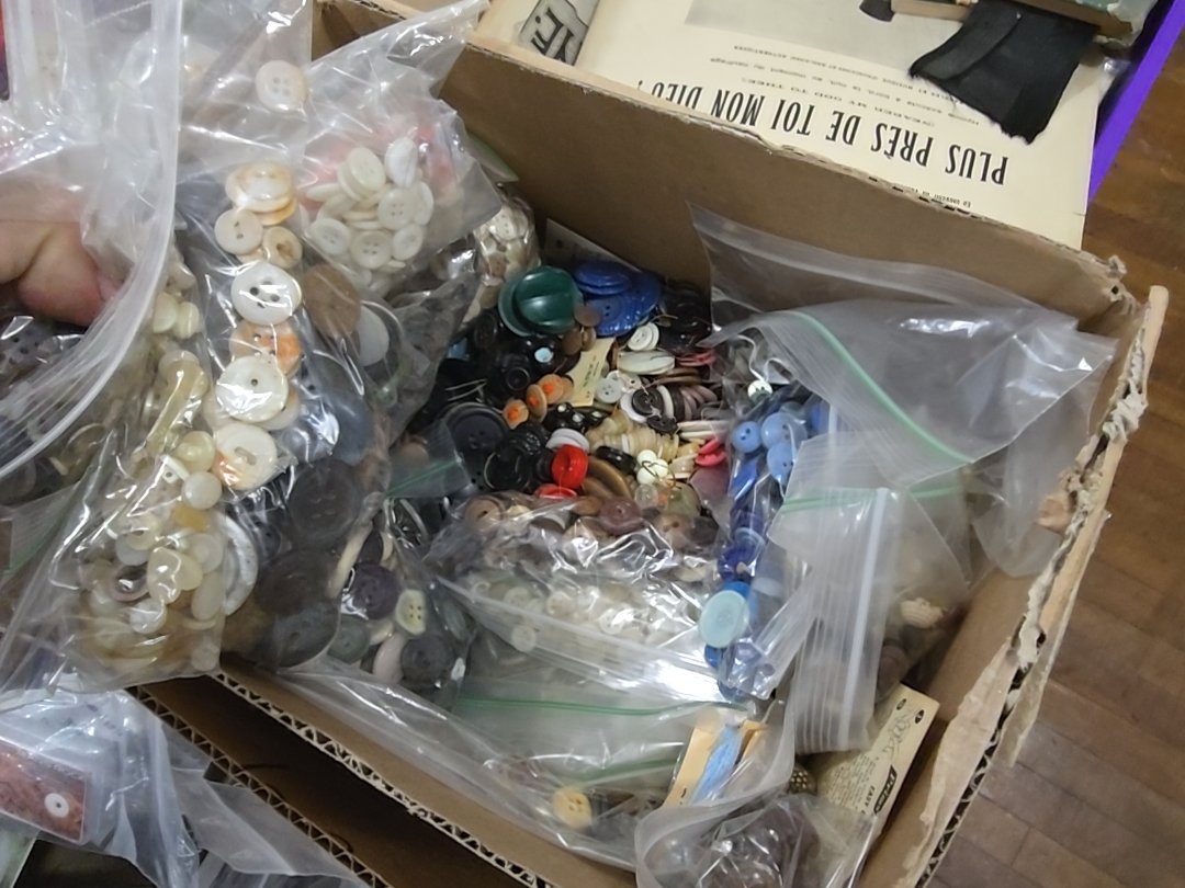 box lot of vintage buttons as found
