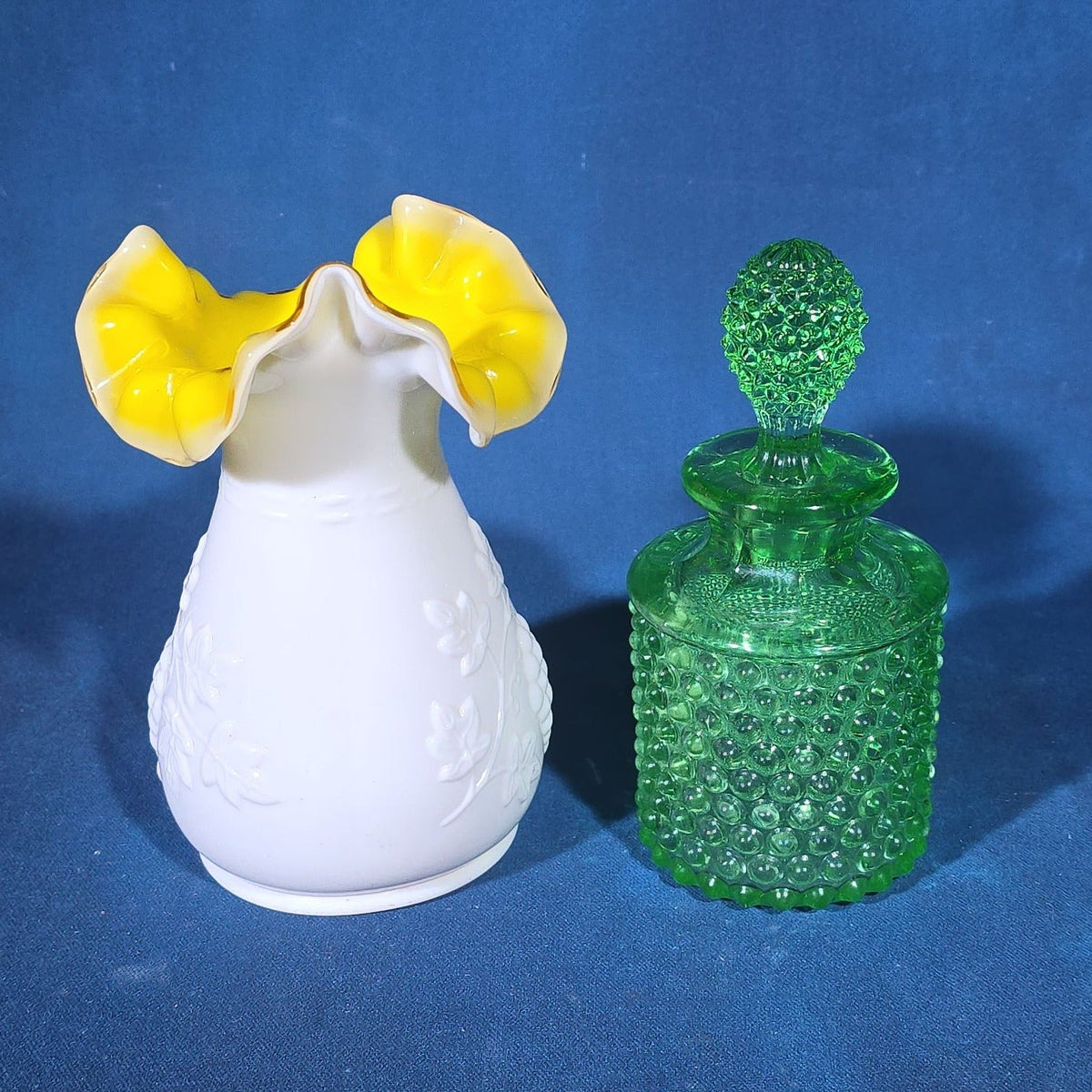 Pair of Vintage Art Glass Pieces including White Cased Glass Vase with Yellow Ruffled Rim and Green Hobnail Glass Decanter with Stopper