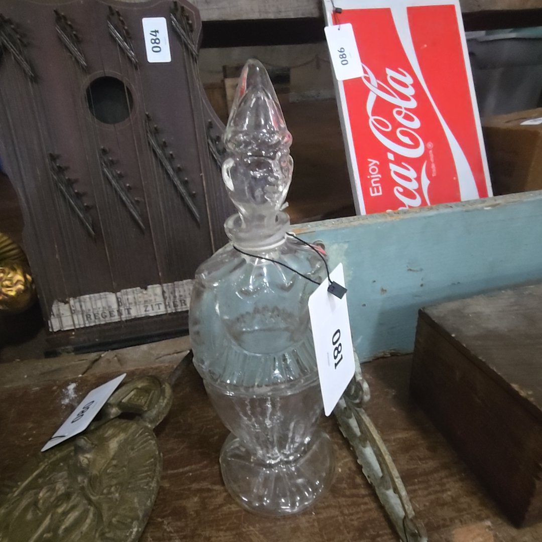 clear glass clown bottle
