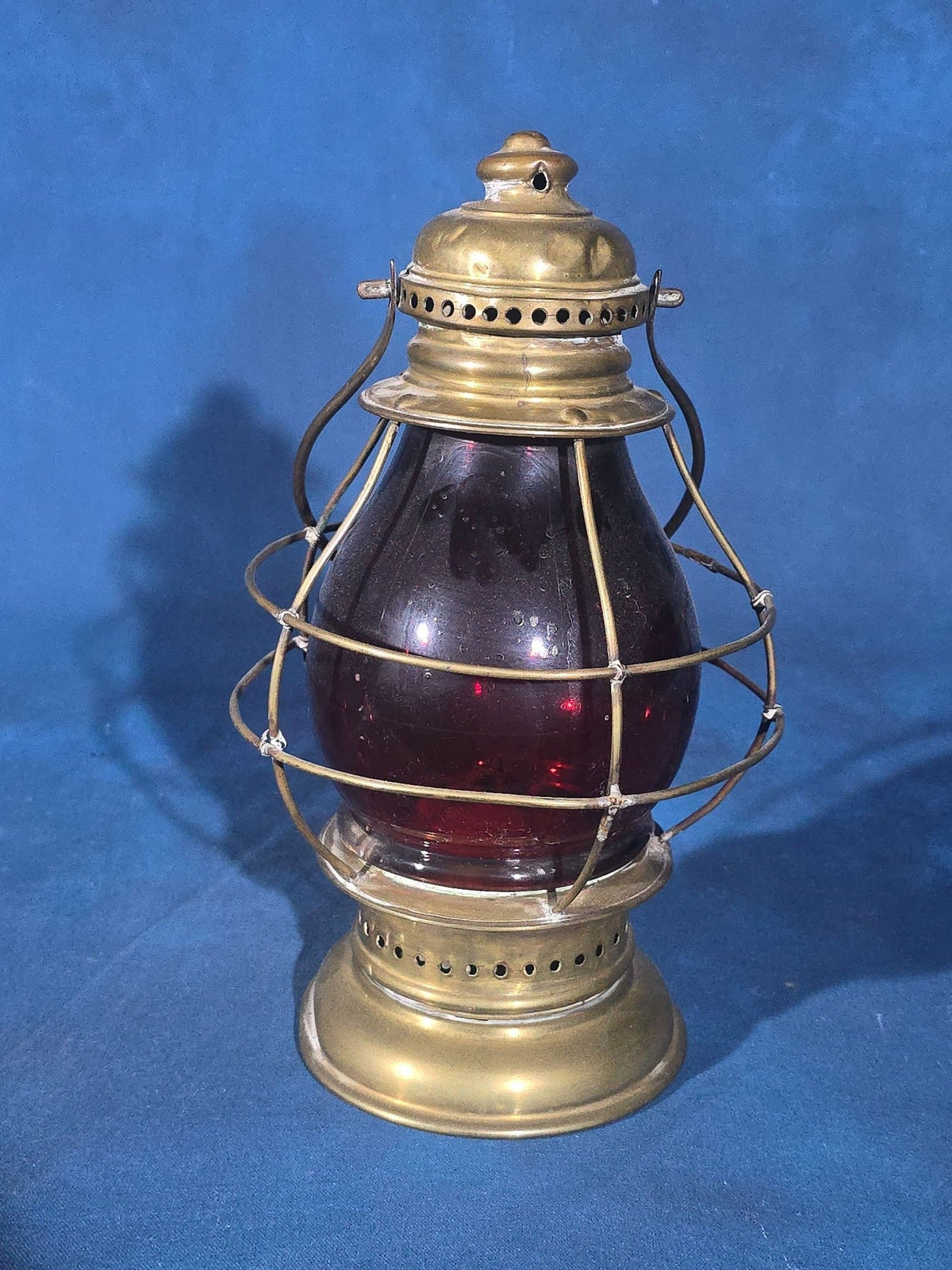 Antique Brass Lantern with Red Globe and Wire Cage Guard