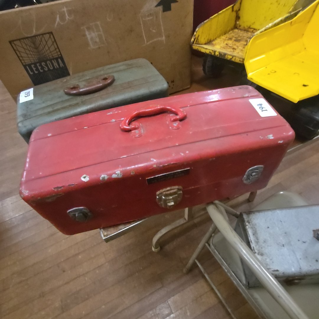 red tackle box with contents