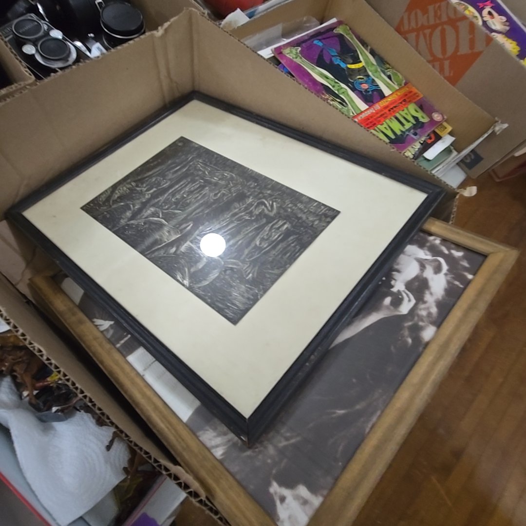box lot of framed art including Wizard of Oz
