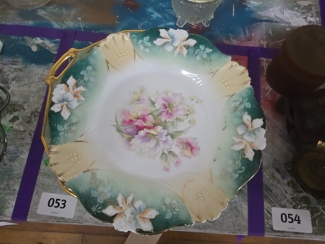 mixed grouping of various decorated China plates