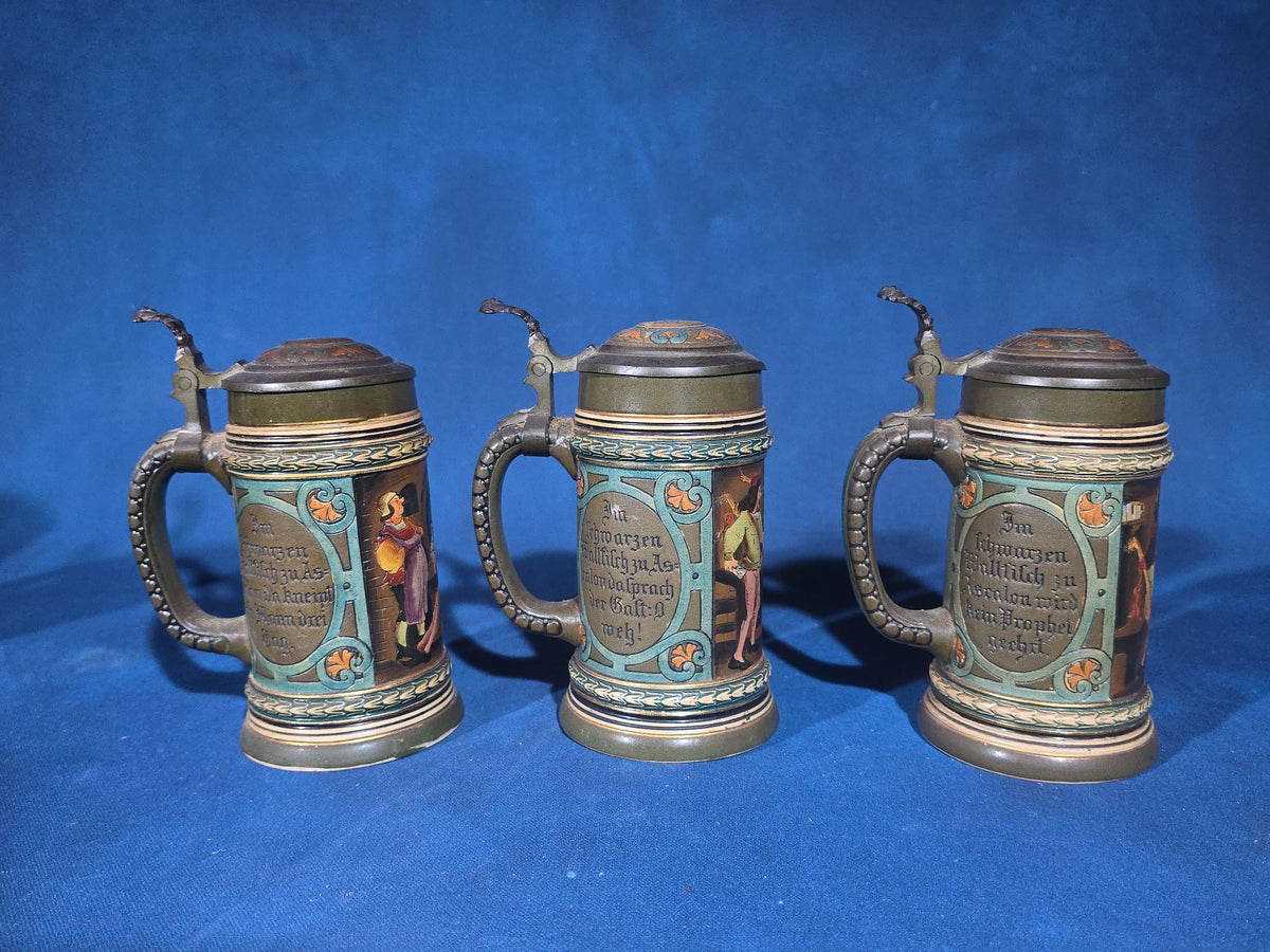 Grouping of Six Antique German Pottery Steins and Lidded Pitcher with Tavern Scenes, Stamped Germany