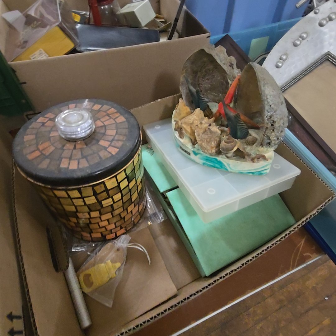 box lot with shell art, tin, and more