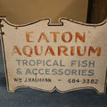 Lot 115 - Vintage Hand-Painted Double-Sided Wooden Trade Sign, Eaton Aquarium Tropical Fish & Accessories, Wm. J. Hagmann, 32" W x 24-3/4" H