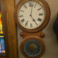 Lot 130 - Vintage Eight-Day Figure-Eight Wall Clock with Inlaid Case and Reverse-Painted Pendulum Glass, 16" L x 29" H