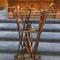 Lot 026 - Antique Cast Iron Figural Cane Stand with a Collection of Antique and Vintage Walking Canes and Swords, 17-1/2" L