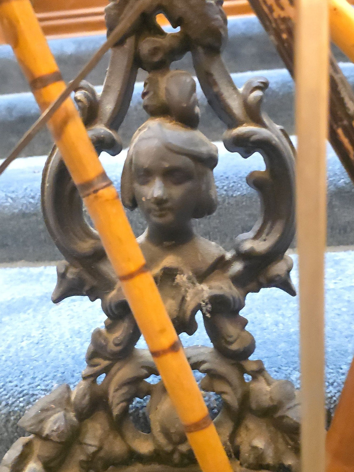 Antique Cast Iron Figural Cane Stand with a Collection of Antique and Vintage Walking Canes and Swords