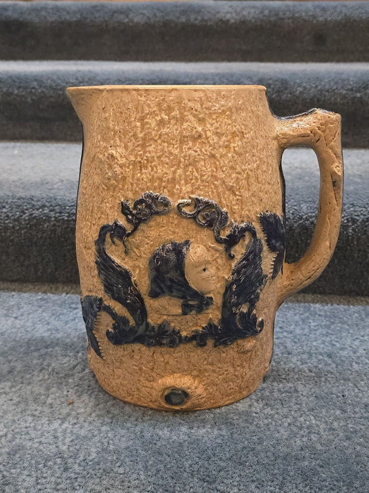 Antique Stoneware Pitcher with Applied Cobalt Griffin and Rose Decoration