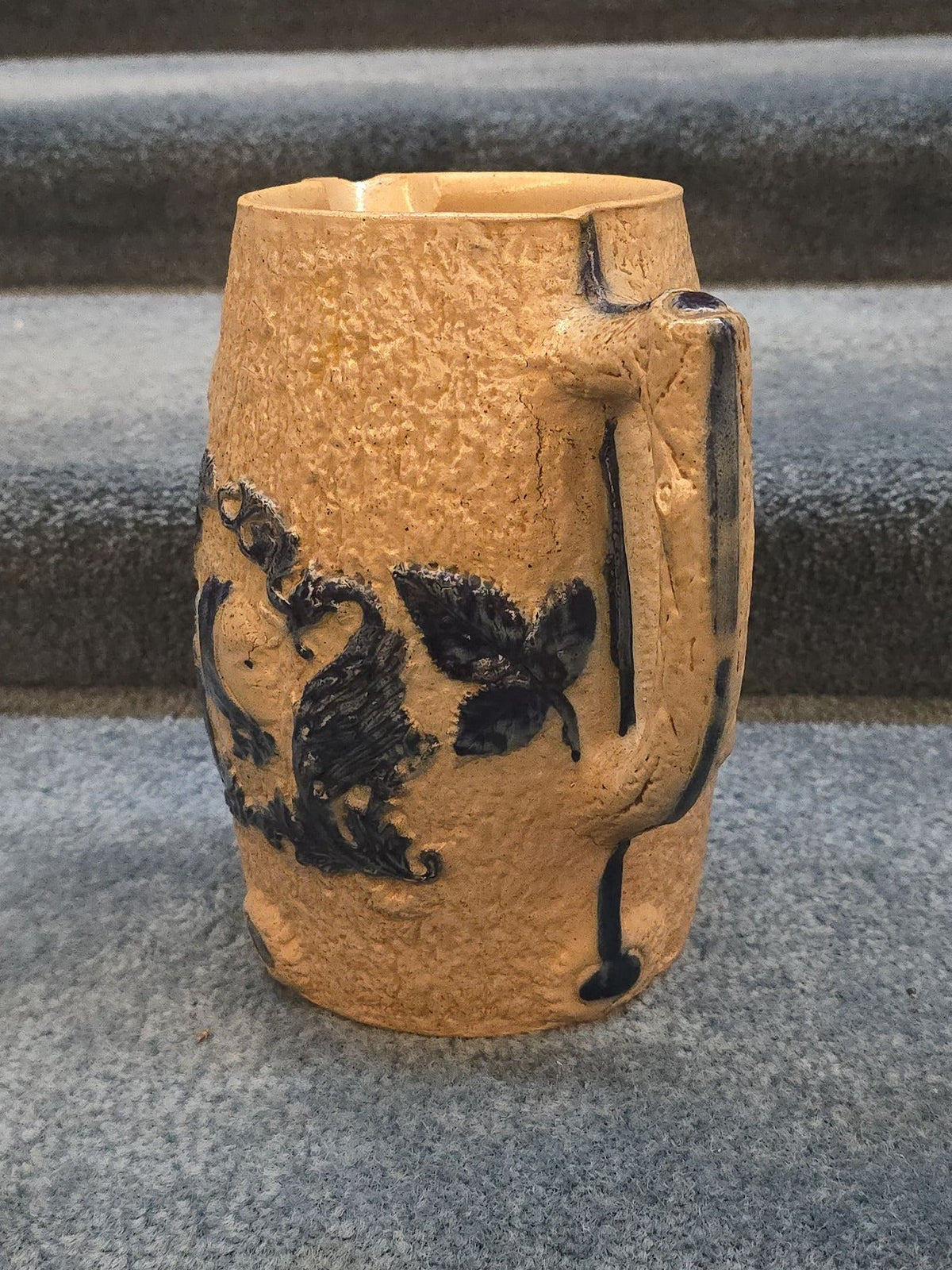 Antique Stoneware Pitcher with Applied Cobalt Griffin and Rose Decoration