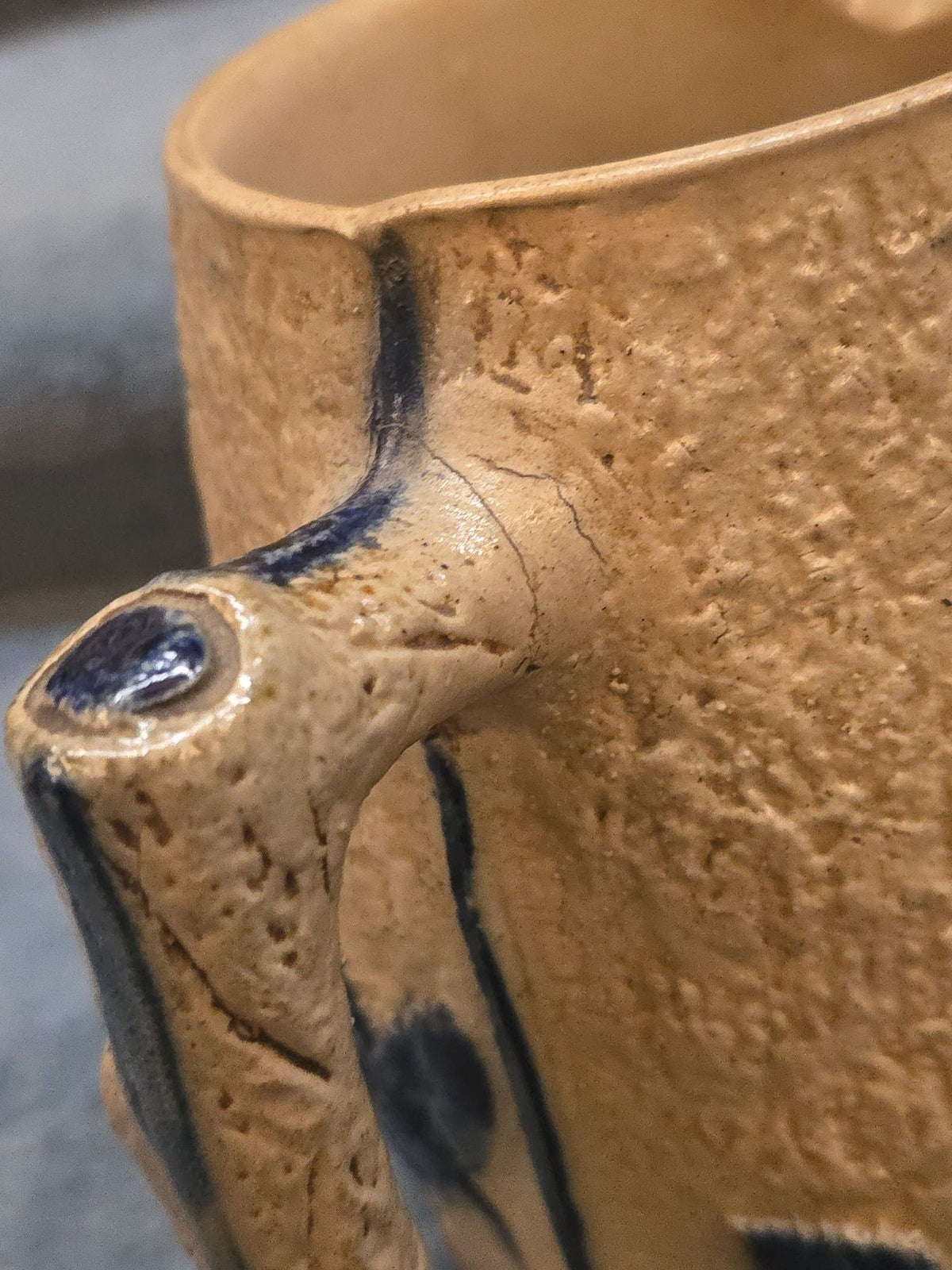 Antique Stoneware Pitcher with Applied Cobalt Griffin and Rose Decoration