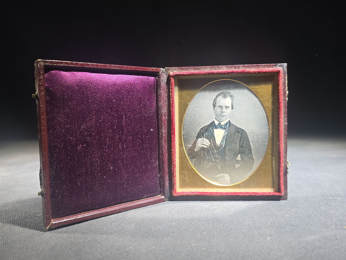 Antique 1/6th Plate Daguerreotype Photograph of a Young Man Wearing a Plaid Vest and Bow Tie in Full Leatherette Case