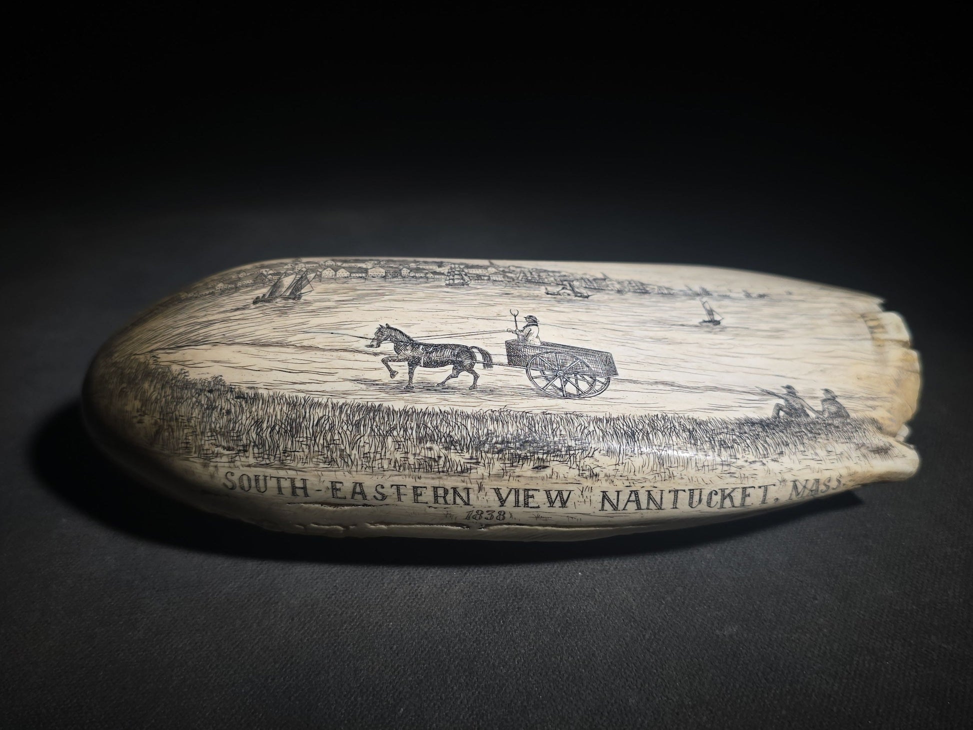 Antique Scrimshaw Whale Tooth engraved with "South Eastern View Nantucket, Mass 1838" Harbor Scene, Town Waterfront, Sailing Vessels, Church Steeples, and Horse-Drawn Cart